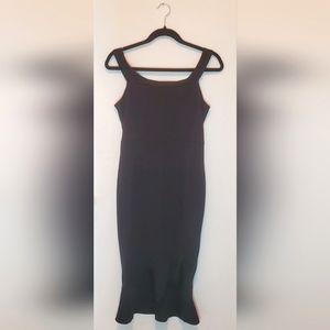 Black mini dress with asymmetrical ruffle